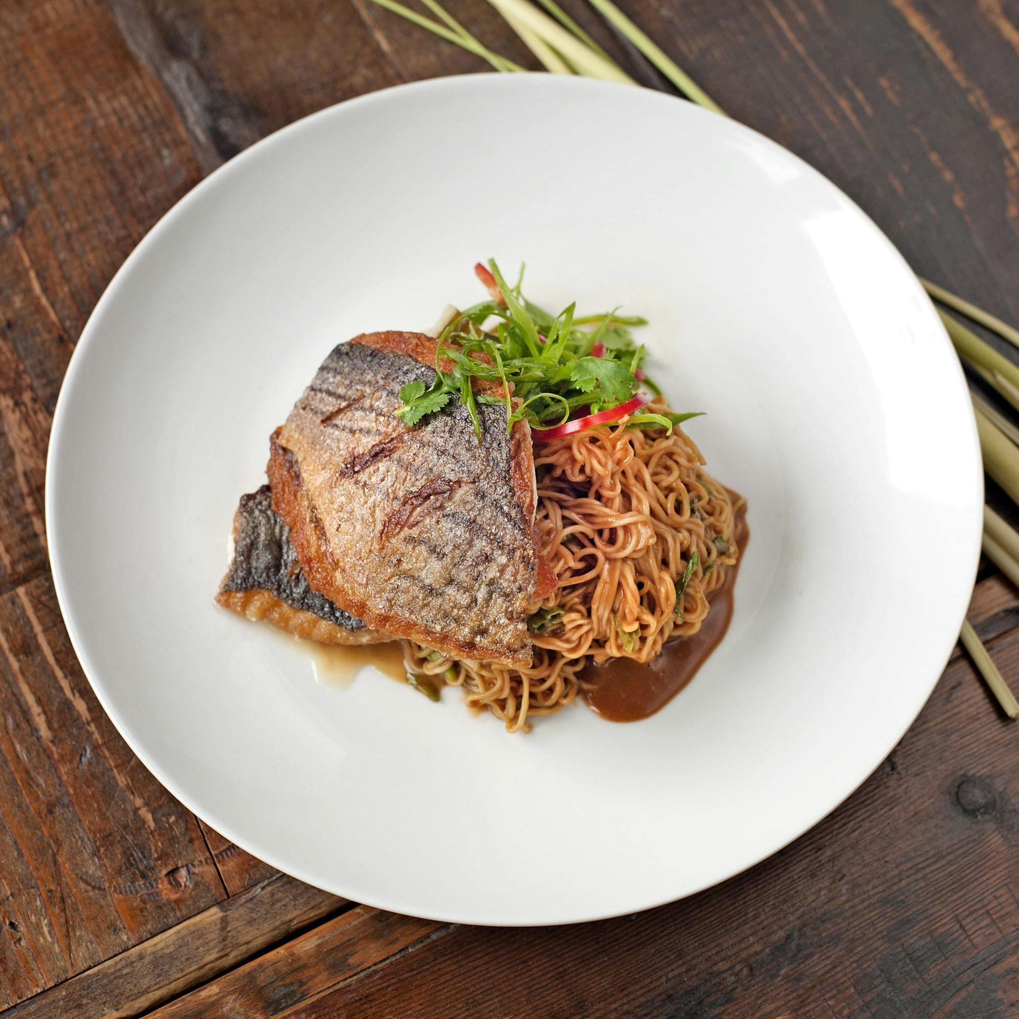 glazed salmon on a bed of noodles