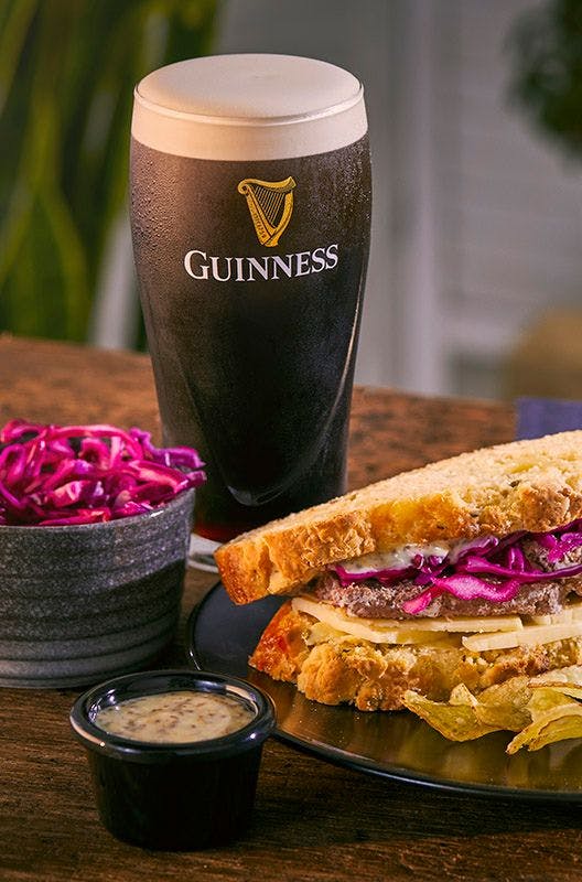 sandwich with a pint of Guinness and red cabbage