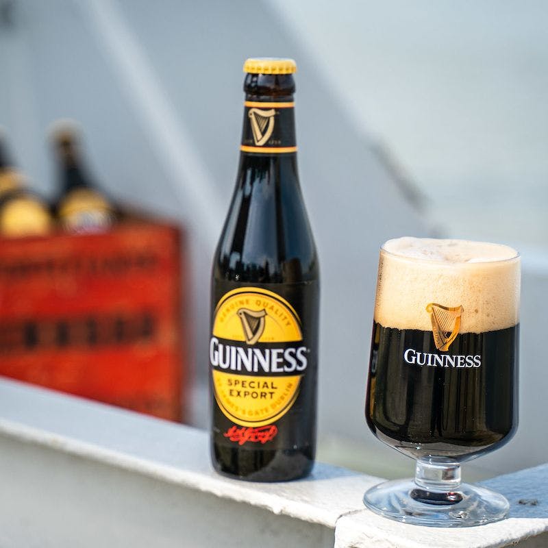 Guinness Special Export in a bottle and a pint glass