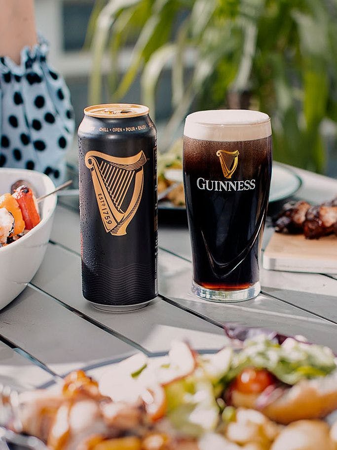having meal with guinness on table